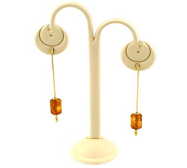 Delicate hanging gold plated silver earrings with cognac Baltic amber in the shape of a cylinder