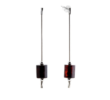 Delicate hanging silver earrings with a dark cherry Baltic amber in the shape of a cylinder