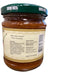 Jar with a green lid and label on a wooden surface