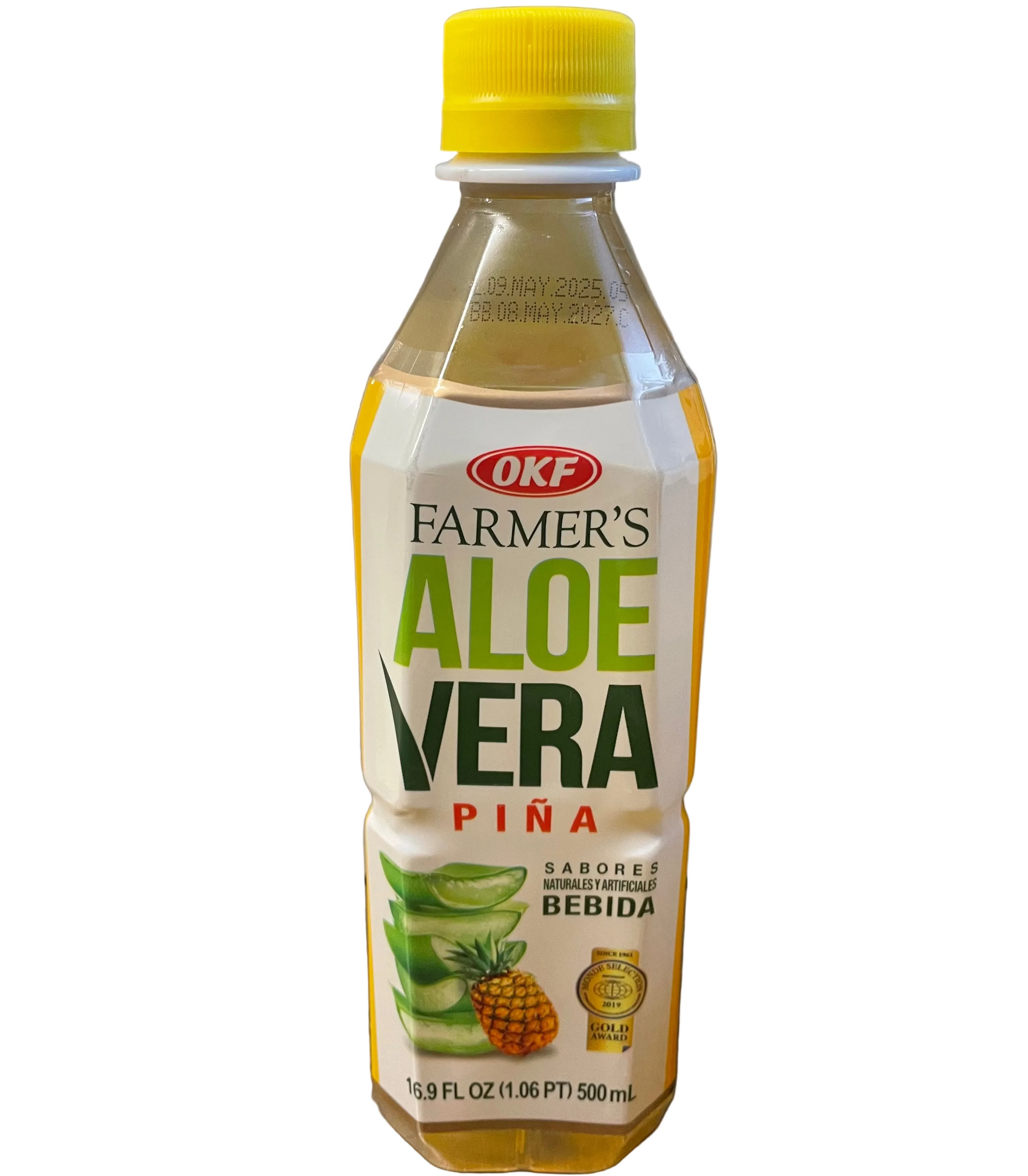 Bottle of Farmer's Aloe Vera Piña on a surface with a blurred background