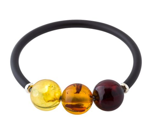 A beautiful adjustable bracelet with a built-in spring with Baltic amber balls in three colors