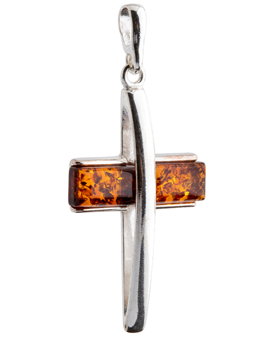 A delicate silver and amber cross in cognac color