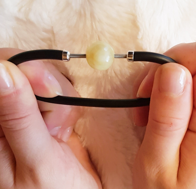 An impressive bracelet with a built-in spring with a ball of milky Baltic amber