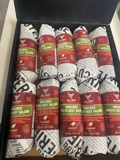 Box of sliced salami packages with visible branding