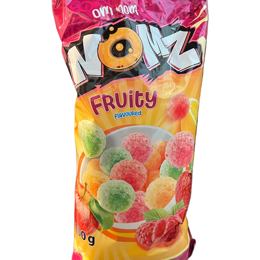 Packaged fruit gummies with colorful label on a metallic surface