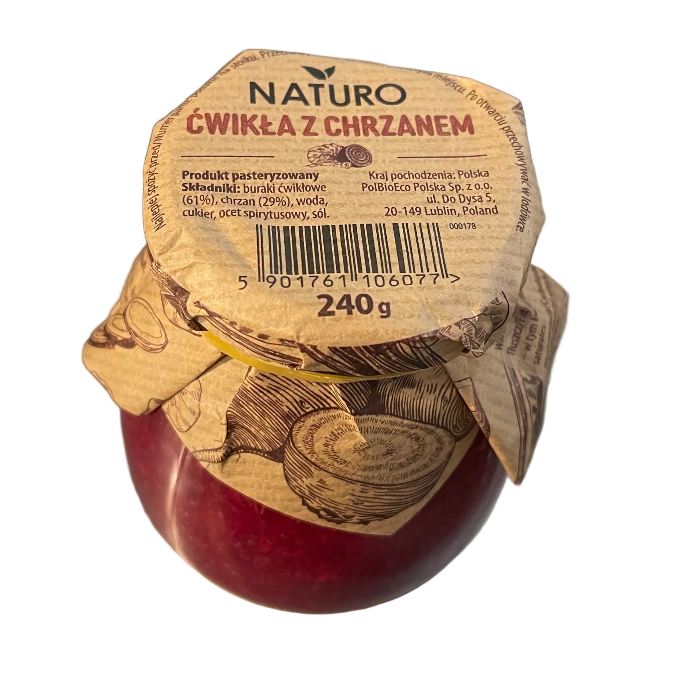 Red onion with a brown paper label on a metallic surface