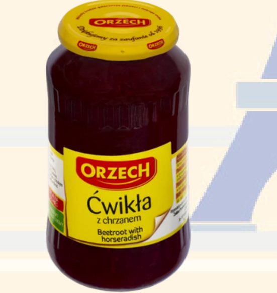 Jar of Orzech beetroot with horseradish on a colorful background
