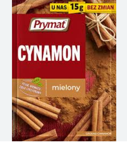 Prymat cinnamon packaging with cinnamon sticks on a red background