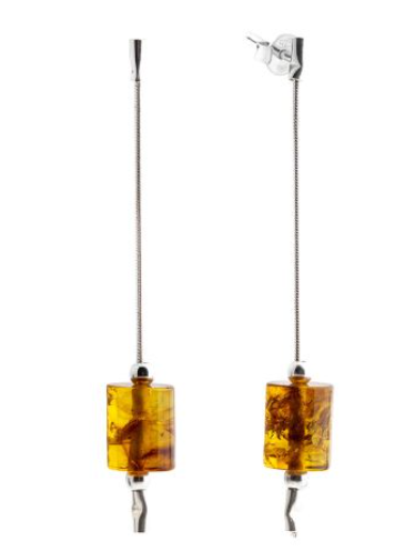 Delicate hanging silver earrings with cognac Baltic amber in the shape of a cylinder