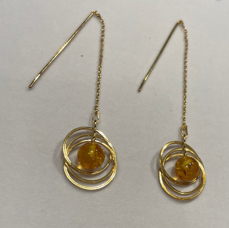 Original amber ball and circle earrings hanging on a gold 925 silver plated chain
