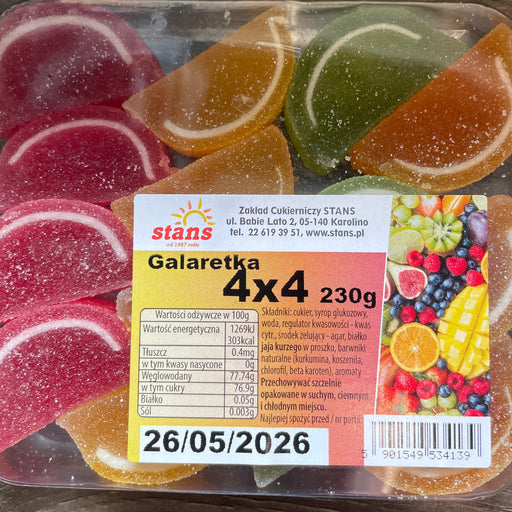 Packaged fruit-flavored gummy candies with a label on a wooden surface