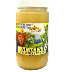 Jar of acacia honey with a label on a white background
