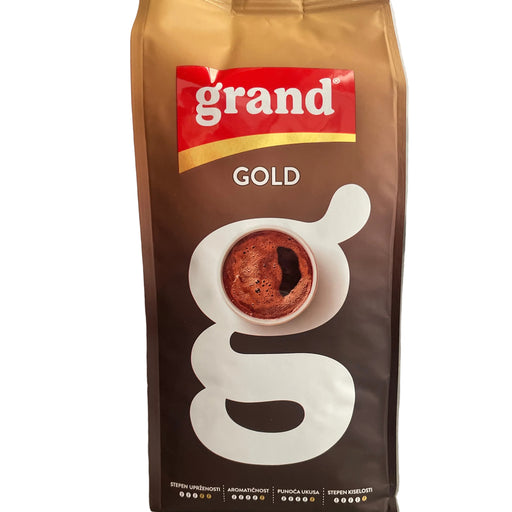 Coffee package with 'grand' branding on a metallic surface