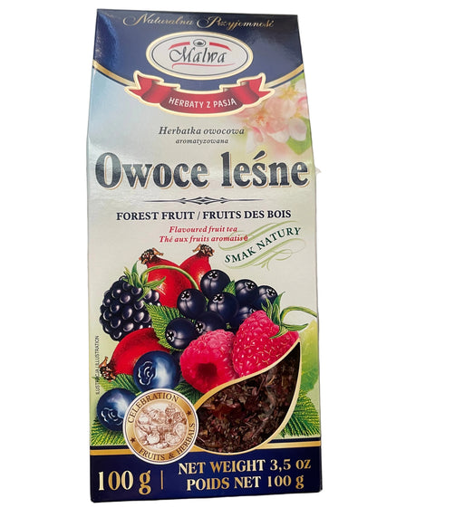 Packaging of forest fruit spread with berries on a gray surface
