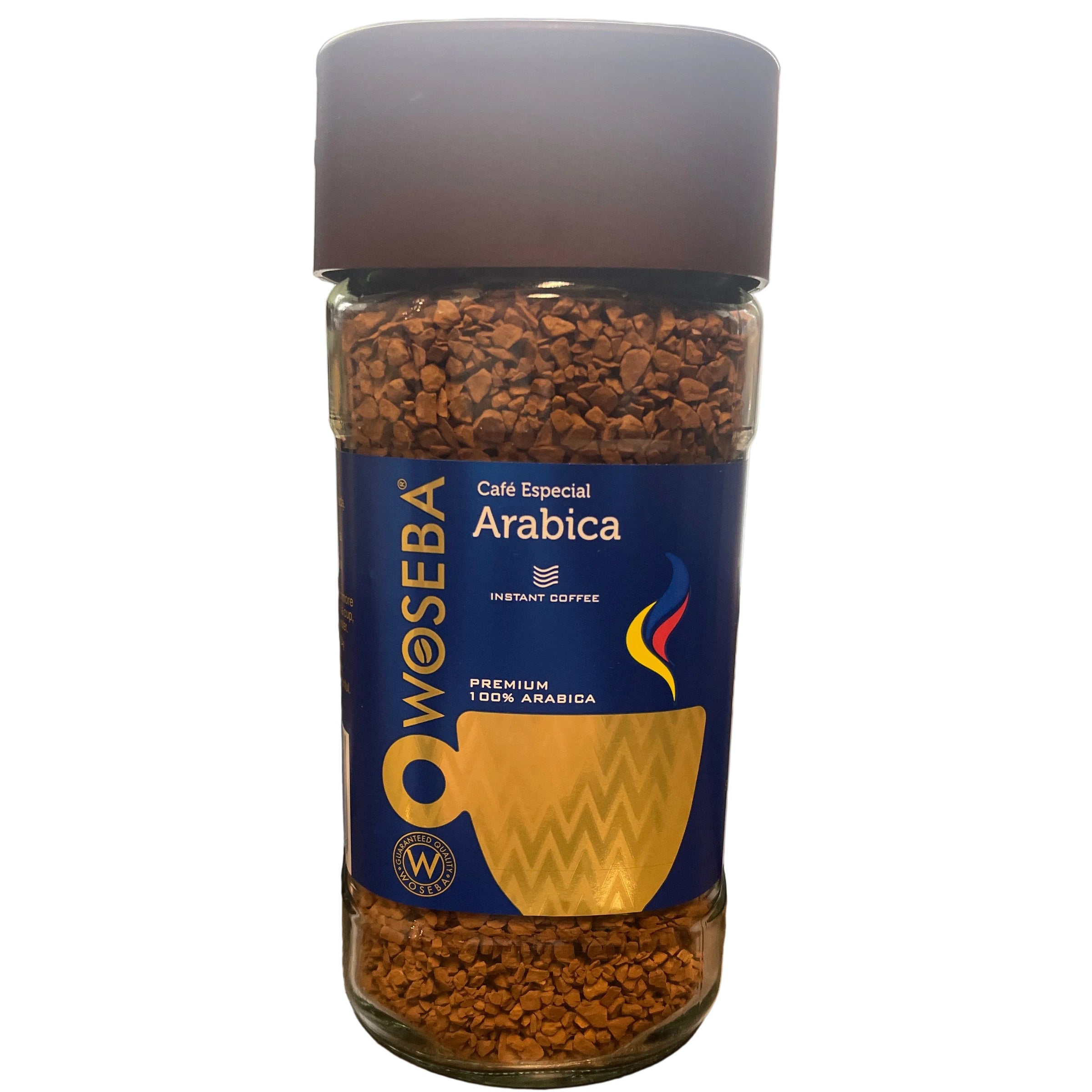 Bottle of Woesba Arabica coffee on a wooden surface with a blurred background