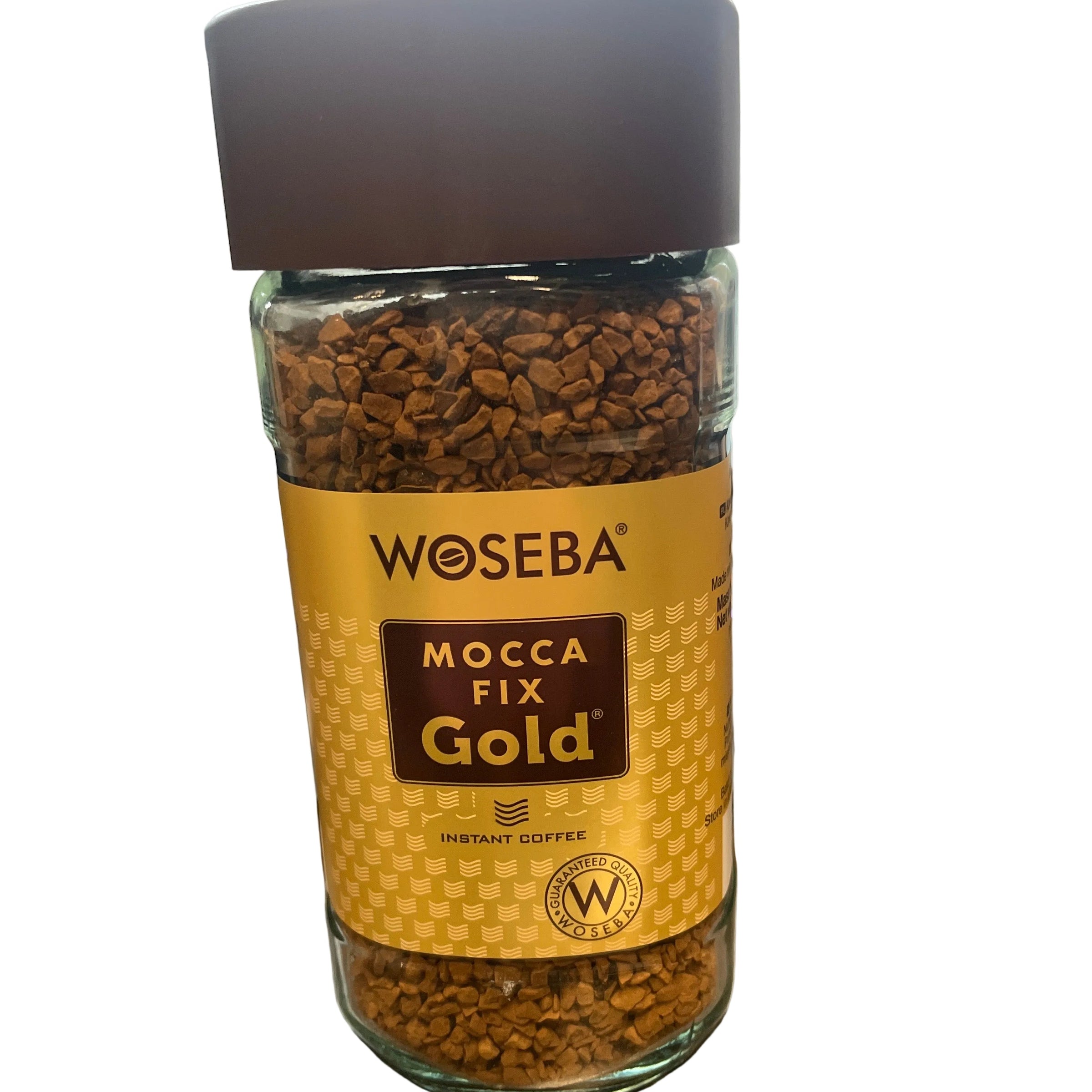 Bottle of Woebea Mocca Fix Gold coffee on a wooden surface with a blurred background
