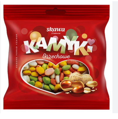 Red package of skawa Kamyki Orzechowe with colorful candies and peanuts on a white background