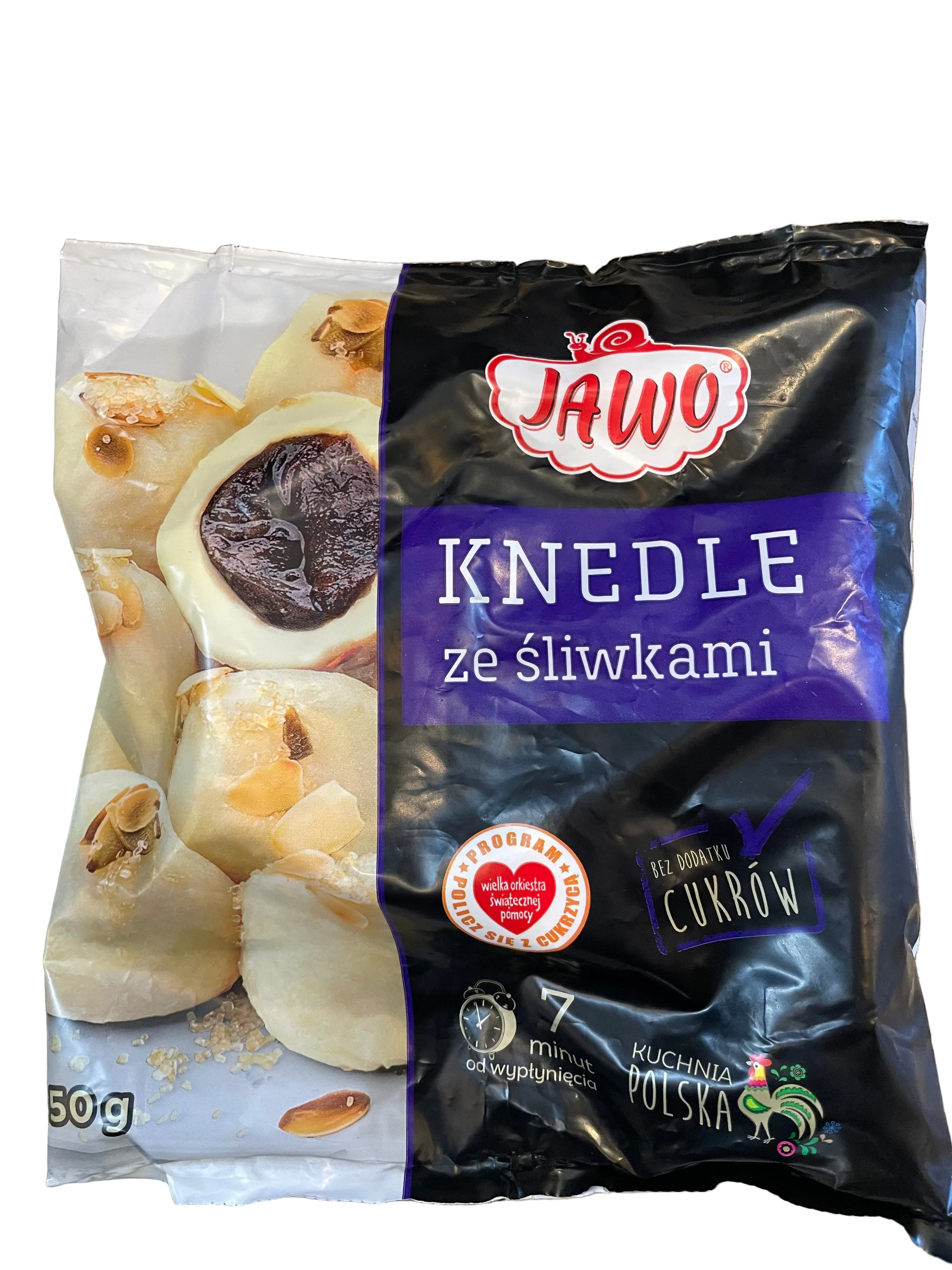 Packaged knedle with plums on a wooden surface