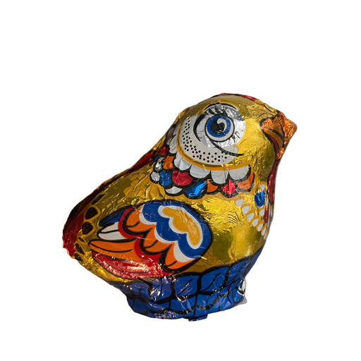 Colorful bird-shaped chocolate on a metallic surface