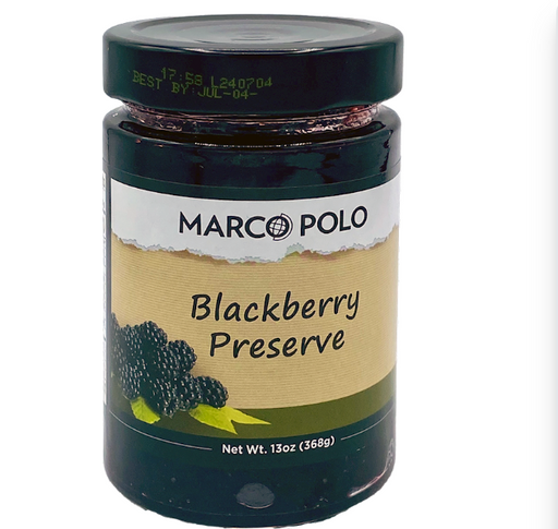 A jar of Marco Polo Blackberry Preserve on a plain white background. The jar has a dark green lid and a label with a beige center and green and black graphics.