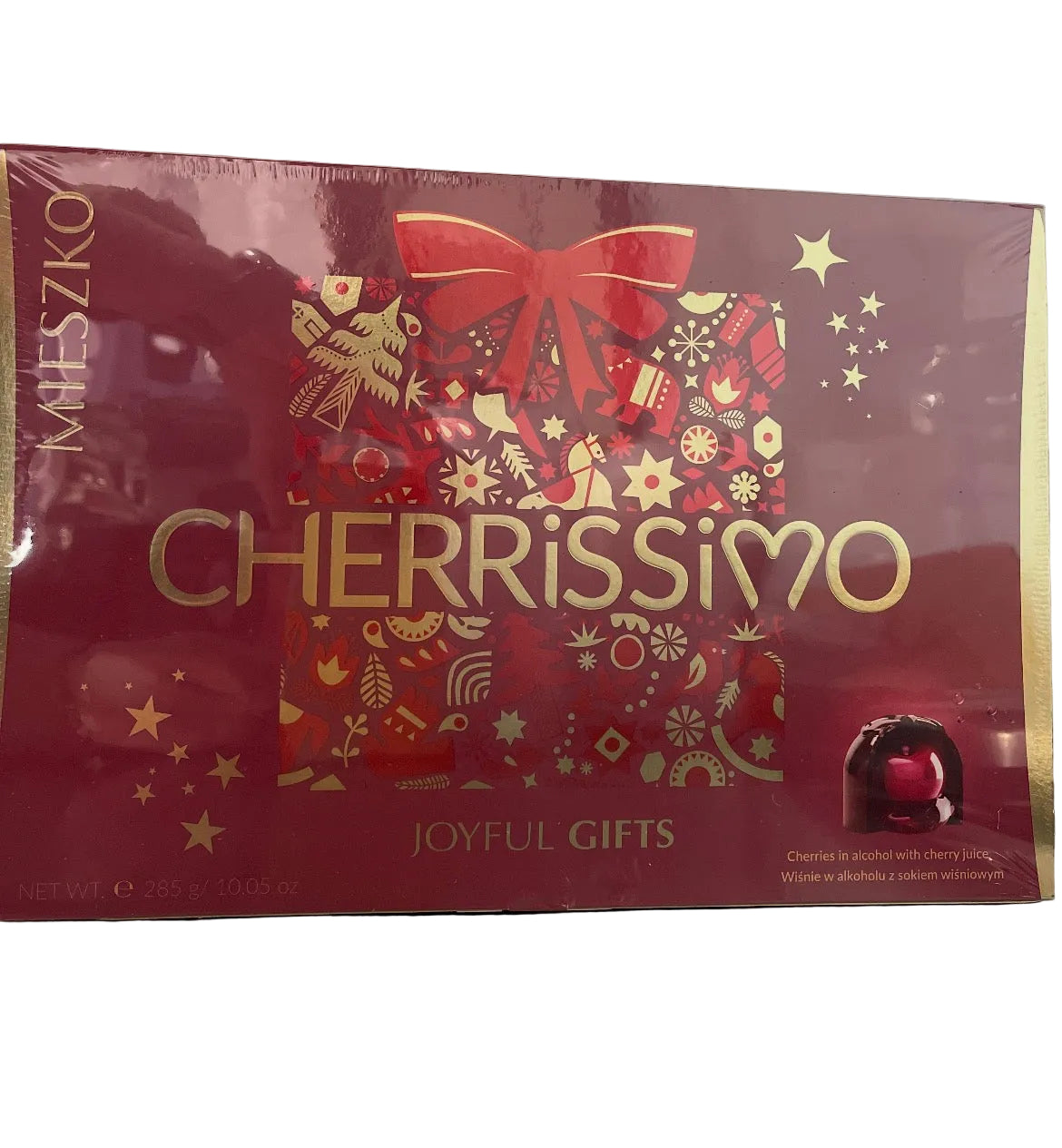 Box of Kieszko Cherrissimo chocolates with decorative design on a gray background
