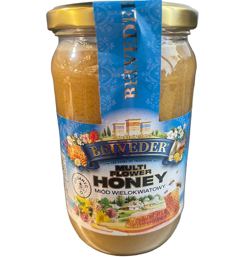 Jar of Belveder multi-flower honey on a metallic surface