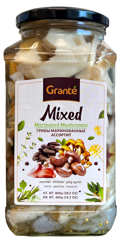 A jar of Granté brand marinated mixed mushrooms, showing various types of mushrooms inside the jar.