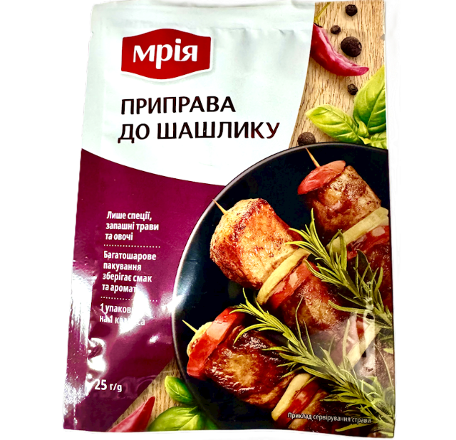 Spice packet for shashlik with a picture of skewered meat and herbs on a white background
