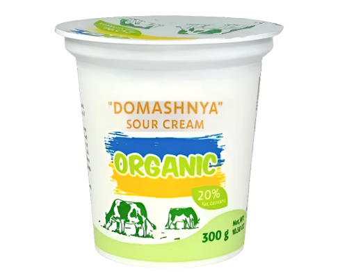 Container of Domashnya organic sour cream on a white background