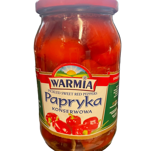 Jar of Warmia Papryka pickled sweet red peppers on a desk