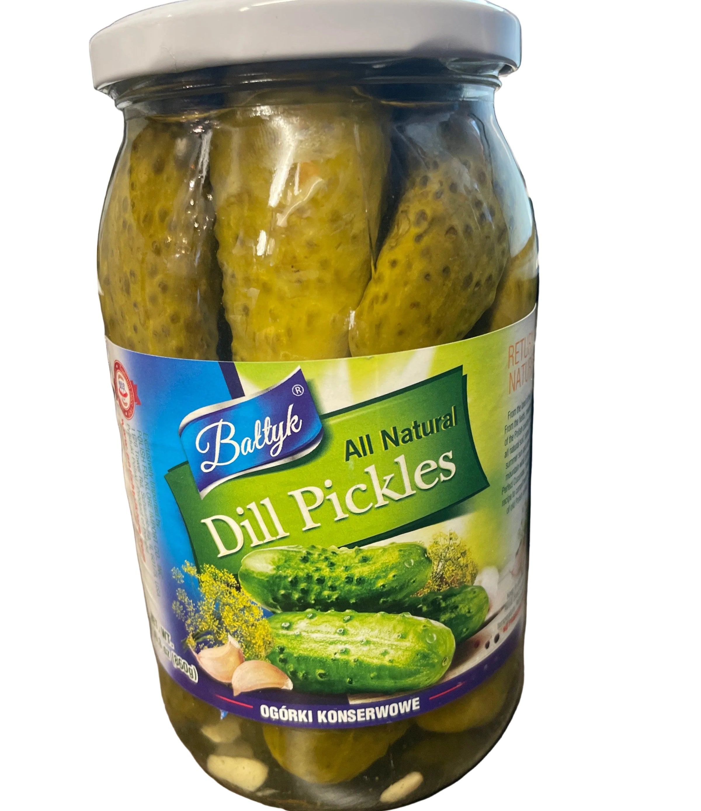 Jar of dill pickles with a label on a wooden surface