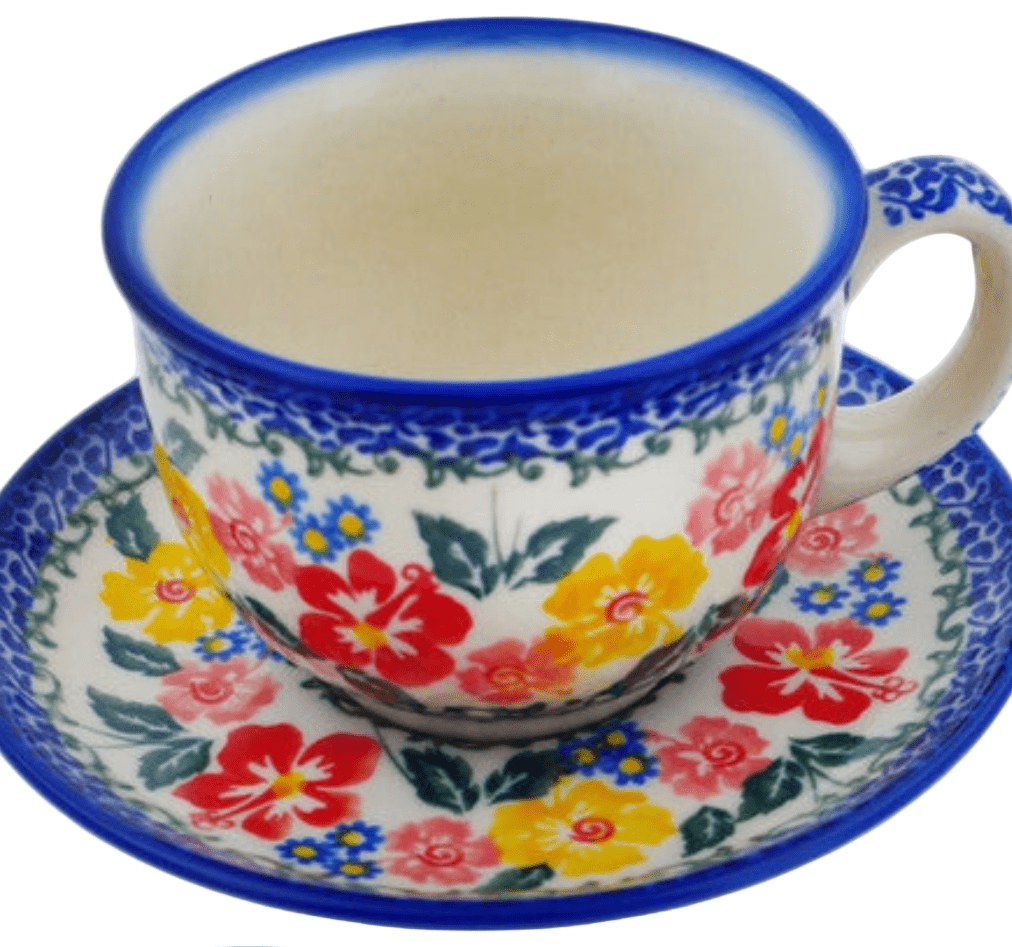 Colorful floral teacup and saucer on a white background