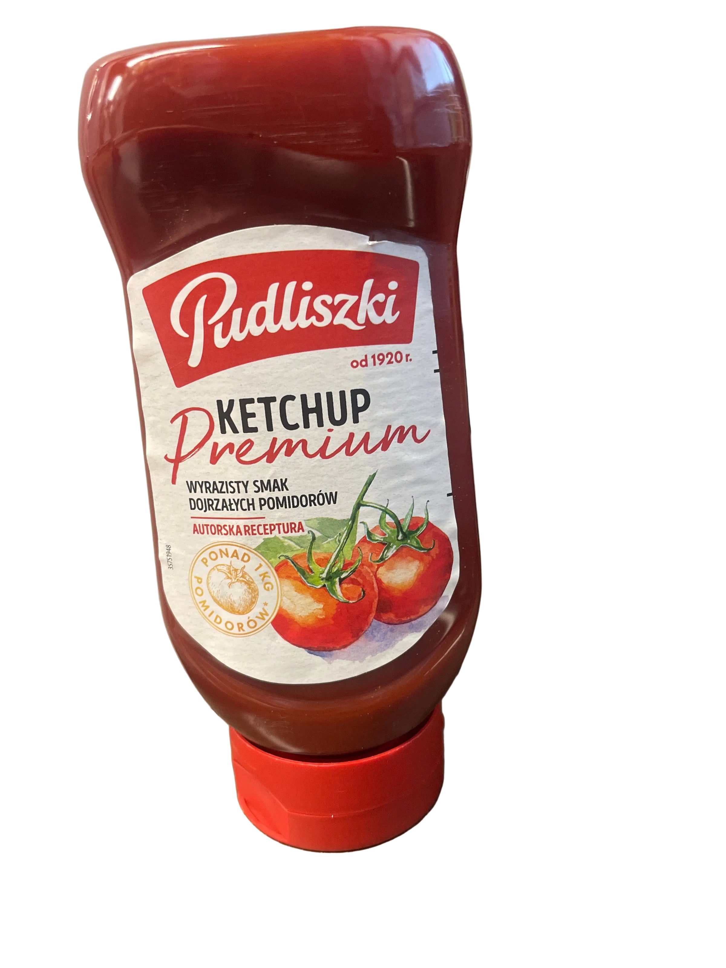 Ketchup bottle with a red cap on a wooden surface