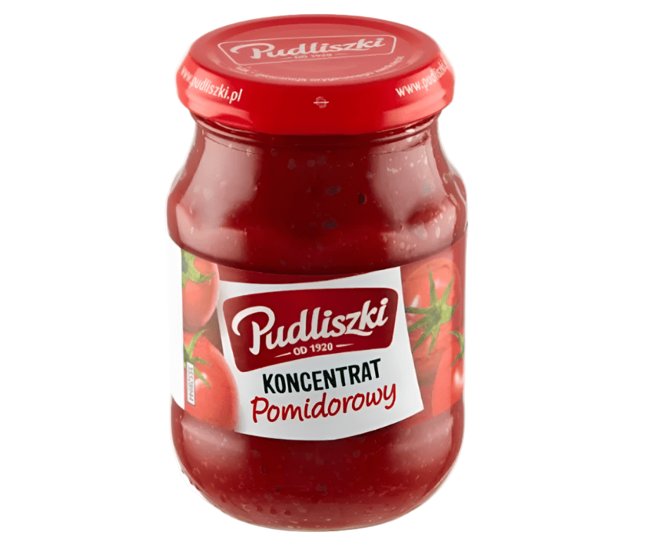 Jar of Pudliszki tomato concentrate on a white background
