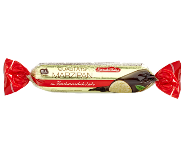 A wrapped candy bar labeled 'Schlunder Marzipan' with a visible chocolate glaze and marzipan texture, predominantly white and red packaging.
