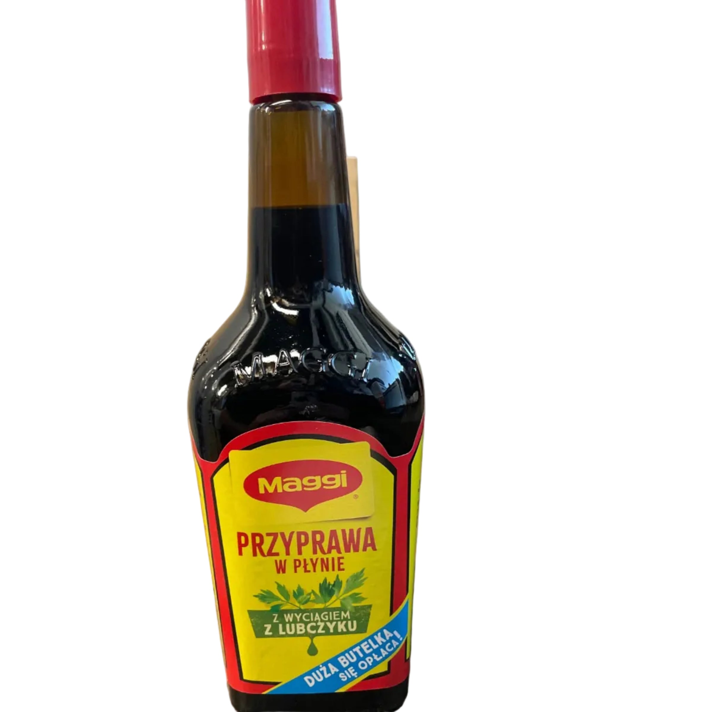 A bottle of Magdi Polish Raw Olive Oil lying on a wooden table, with another bottle and a can in the background on a shelf.