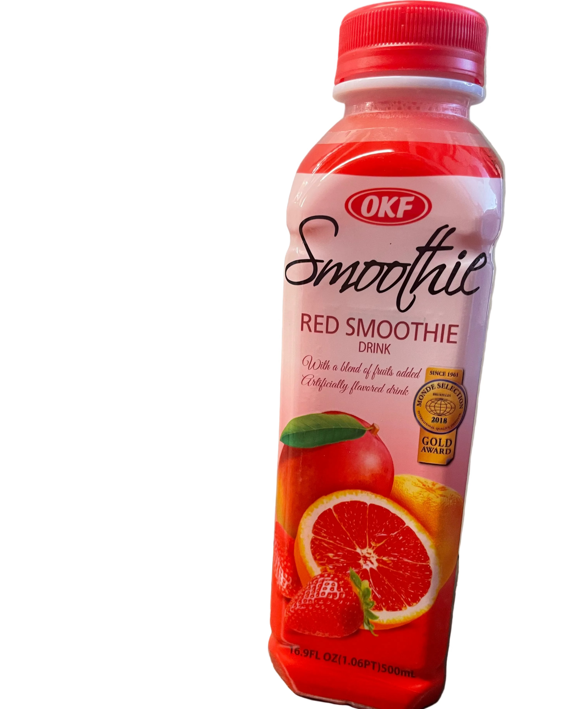 OKF Red Smoothie bottle on a wooden surface with a neutral background