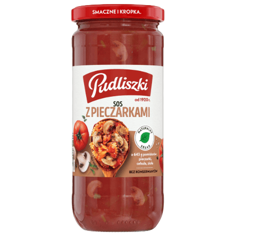 Jar of Pudliszki mushroom sauce with a red lid on a transparent background