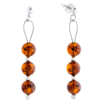 Delicate hanging silver earrings with natural cognac ball Baltic amber
