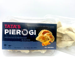 Packaged Tata's Pierogi flawor potato cheddar bacon with visible pierogies on a white background