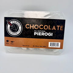 Packaged chocolate pierogi with Pierogi Polish Comfort Food label on a gray background