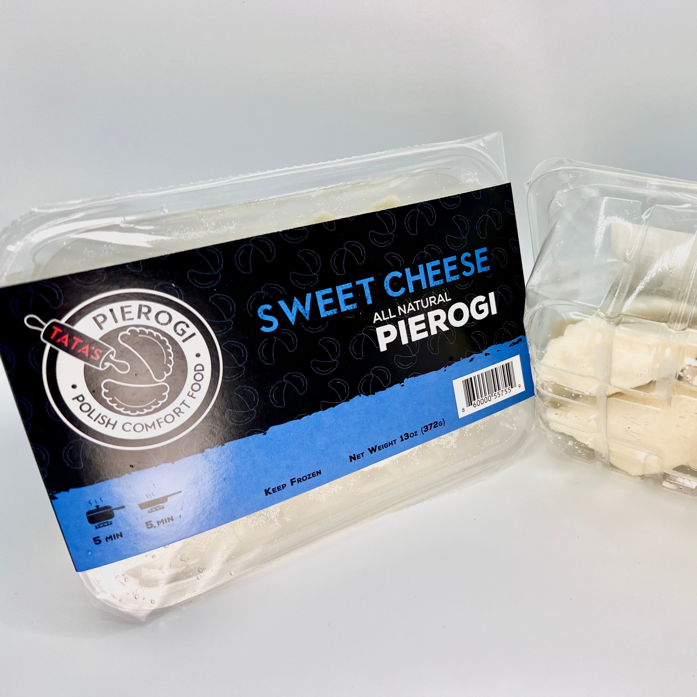 Packaged sweet cheese pierogi with a label on a gray background