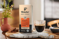 Cup of Tchibo dark roast arabica ground coffee with rich crema