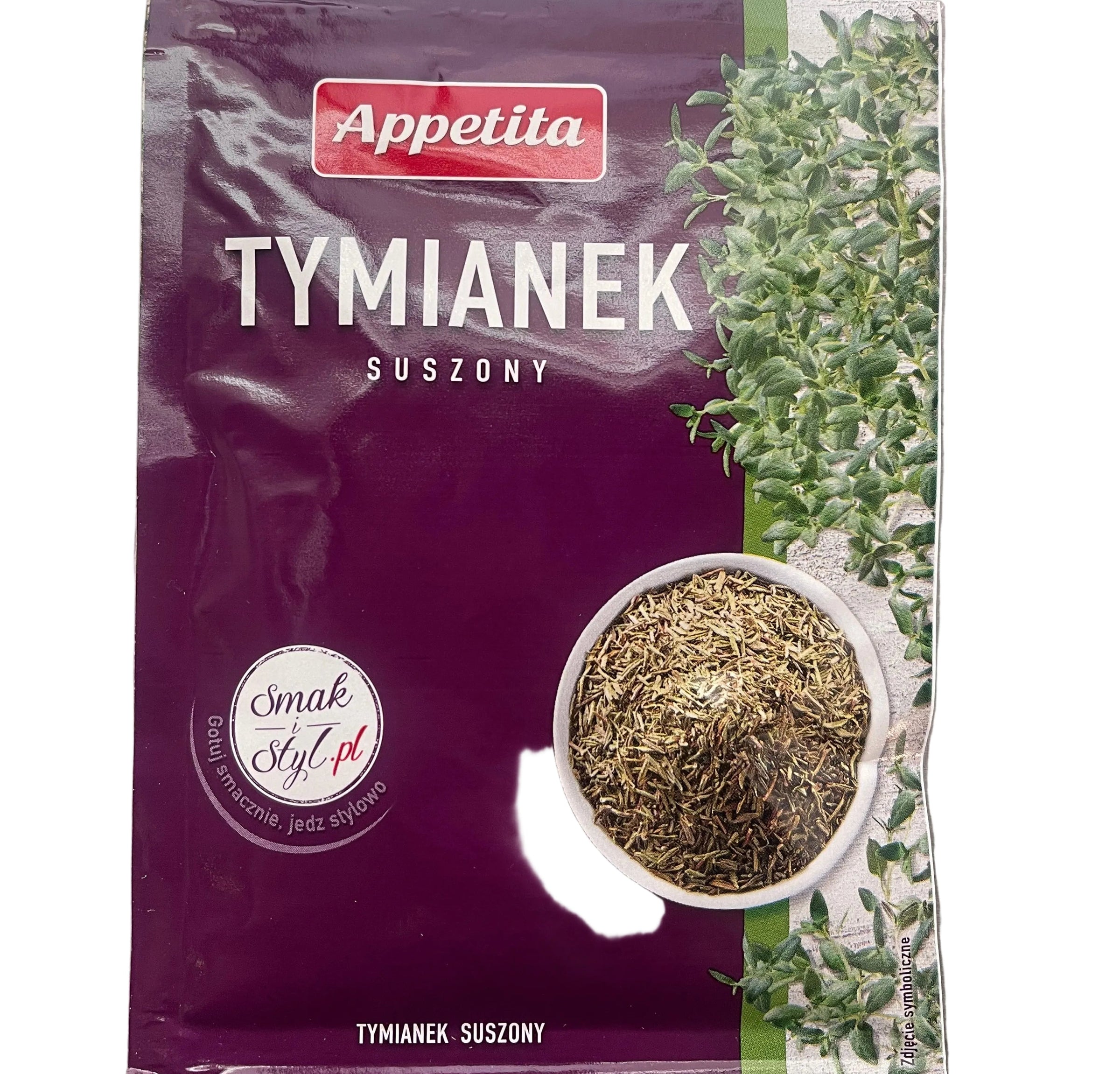 Purple package of Tymianek with a bowl of dried herbs on a gray background