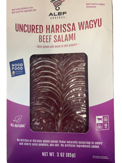 Packaged Uncured Harissa Wagyu Beef Salami with Alef Shukr on a purple and white background