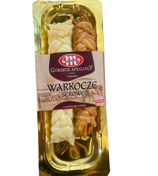 Packaged food item with a gold and brown label on a metallic surface