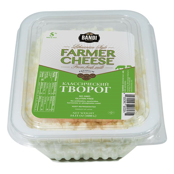 Packaged farmers cheese in a plastic tray with label information visible.